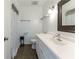Bright bathroom with a white vanity, decorative mirror and tiled floor at 1652 Weymouth Ct, Tucker, GA 30084