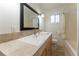 Bathroom featuring granite counters, sink, mirror, and shower at 1652 Weymouth Ct, Tucker, GA 30084