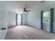 Bedroom featuring neutral carpet, ceiling fan, and curtains at 1652 Weymouth Ct, Tucker, GA 30084