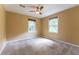 Bedroom with neutral paint, carpet and windows that let in lots of natural light at 1652 Weymouth Ct, Tucker, GA 30084