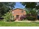 Charming brick home featuring a well-manicured lawn and mature trees, creating a welcoming curb appeal at 1652 Weymouth Ct, Tucker, GA 30084