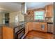 Well-equipped kitchen with stainless appliances, granite countertops, and a stylish backsplash at 1652 Weymouth Ct, Tucker, GA 30084