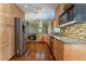 Kitchen with stainless steel appliances, granite countertops, and custom cabinetry at 1652 Weymouth Ct, Tucker, GA 30084