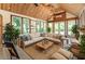 Beautifully decorated living room with vaulted ceilings, wood flooring, and multiple windows at 1652 Weymouth Ct, Tucker, GA 30084
