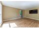 Bright living room with hardwood floors, neutral walls, and large windows offering ample natural light at 1652 Weymouth Ct, Tucker, GA 30084
