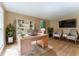 Cozy home office with a built-in bookcase, modern desk, and natural lighting at 1652 Weymouth Ct, Tucker, GA 30084