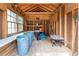 Well lit storage shed with windows, shelves, and working space, perfect for hobbies or gardening at 1652 Weymouth Ct, Tucker, GA 30084