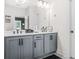 The well-lit bathroom offers dual sinks and a modern vanity for a clean, updated look at 2744 Bell Se Dr, Smyrna, GA 30080