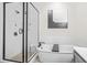 Modern bathroom featuring glass shower, soaking tub, and black hardware at 2744 Bell Se Dr, Smyrna, GA 30080