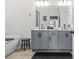 Double vanity bathroom with soaking tub and tiled floors offers spa-like comfort at 2744 Bell Se Dr, Smyrna, GA 30080