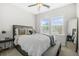Bright bedroom features neutral walls, a ceiling fan, and a large window at 2744 Bell Se Dr, Smyrna, GA 30080