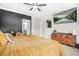 Bright bedroom with a large flat screen TV, decorative accents, and natural light at 2744 Bell Se Dr, Smyrna, GA 30080