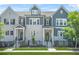 Charming townhomes with gray and white brick, black trim, fenced yards, and well-manicured landscaping at 2744 Bell Se Dr, Smyrna, GA 30080