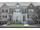 Charming townhomes with gray and white brick, black trim, fenced yards, and well-manicured landscaping at 2744 Bell Se Dr, Smyrna, GA 30080