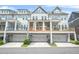 Exterior view of townhomes with porches and garages at 2744 Bell Se Dr, Smyrna, GA 30080
