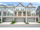 Exterior view of townhomes with porches and garages at 2744 Bell Se Dr, Smyrna, GA 30080