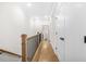 Hallway with wood floors, white walls, and black iron railing at 2744 Bell Se Dr, Smyrna, GA 30080