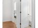 Hallway with hardwood floors and view into bedroom and Bedroom at 2744 Bell Se Dr, Smyrna, GA 30080
