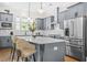 Modern kitchen with gray cabinetry, stainless steel appliances, a quartz island, and pendant lighting at 2744 Bell Se Dr, Smyrna, GA 30080