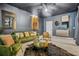 Cozy living room with a dark ceiling, green velvet seating, statement art, and unique decor for a cool vibe at 2744 Bell Se Dr, Smyrna, GA 30080