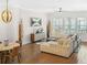 Inviting living room with a cozy seating arrangement, hardwood floors, and large windows that flood the space with natural light at 2744 Bell Se Dr, Smyrna, GA 30080