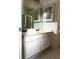 Bathroom featuring double sink vanity with white cabinets, ample counter space, and tile floors at 2945 Dogwood Creek Parkway, Duluth, GA 30096