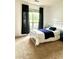 Simple bedroom with a white metal bed frame, black curtains, and neutral carpet at 2945 Dogwood Creek Parkway, Duluth, GA 30096