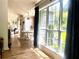 Open concept dining room featuring hardwood floors, large windows, and a view of the backyard at 2945 Dogwood Creek Parkway, Duluth, GA 30096