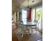 Bright dining room featuring an oval table, seating for six, and large windows at 2945 Dogwood Creek Parkway, Duluth, GA 30096