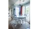 Bright dining area featuring hardwood floors, white accents, large windows and access to the outdoor area at 2945 Dogwood Creek Parkway, Duluth, GA 30096
