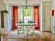 Bright dining room featuring an oval table, seating for six, and large windows at 2945 Dogwood Creek Parkway, Duluth, GA 30096