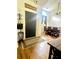 Inviting foyer featuring hardwood floors, a black door, and a view of the dining room at 2945 Dogwood Creek Parkway, Duluth, GA 30096