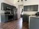 Kitchen featuring stainless steel appliances, dark gray cabinetry, and granite countertops at 2945 Dogwood Creek Parkway, Duluth, GA 30096