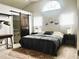 Cozy main bedroom featuring a barn door to bathroom, high ceilings and modern decor at 2945 Dogwood Creek Parkway, Duluth, GA 30096