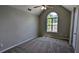 Comfortable bedroom with vaulted ceilings and a large window providing ample light at 3881 Micah Ln, Ellenwood, GA 30294