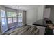 Bright breakfast nook with large windows, adjacent to the kitchen, offering a cozy dining space at 3881 Micah Ln, Ellenwood, GA 30294