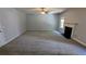 Spacious living room featuring a ceiling fan, fireplace and neutral color palette at 3881 Micah Ln, Ellenwood, GA 30294