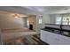 Open living space with a fireplace and a view into the kitchen with stainless steel appliances at 3881 Micah Ln, Ellenwood, GA 30294