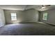 Spacious main bedroom with a vaulted ceiling and a view from two windows at 3881 Micah Ln, Ellenwood, GA 30294
