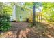 Back exterior view of home featuring a deck with stairs and a walkout basement door at 5372 Martins Crossing Rd, Stone Mountain, GA 30088