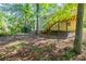 A spacious backyard with a wooden deck accessible via stairs, offering a private outdoor space at 5372 Martins Crossing Rd, Stone Mountain, GA 30088