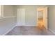 Basement area with neutral paint and carpet, offering a glimpse into an adjoining room at 5372 Martins Crossing Rd, Stone Mountain, GA 30088