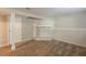Unfinished basement features neutral paint and carpet, plus a unique stone fireplace at 5372 Martins Crossing Rd, Stone Mountain, GA 30088