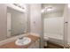 Bathroom features a vanity with large mirror and a tub/shower combo at 5372 Martins Crossing Rd, Stone Mountain, GA 30088