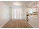 Bright dining area featuring new carpet, natural light and a view of the kitchen at 5372 Martins Crossing Rd, Stone Mountain, GA 30088
