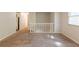 A living area featuring a carpeted floor, a white railing and stairs, neutral walls and natural light at 5372 Martins Crossing Rd, Stone Mountain, GA 30088