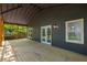 This covered back deck features outdoor lighting and entry into the home at 638 Medford Se Pl, Smyrna, GA 30080