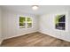 This bedroom has lots of natural light from the two windows, and a great hardwood floor at 638 Medford Se Pl, Smyrna, GA 30080