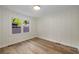 Cozy bedroom with hardwood floors, natural light, and neutral walls at 638 Medford Se Pl, Smyrna, GA 30080
