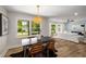 Bright dining area with modern chandelier, adjacent to living room, providing open concept living at 638 Medford Se Pl, Smyrna, GA 30080